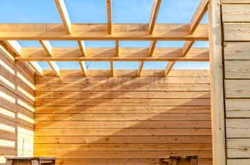 Construction of a new house made of wooden blocks and boards.
