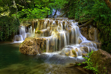 Obraz premium Cascade waterfalls. Krushuna falls in Bulgaria near the village of Krushuna, Letnitsa.