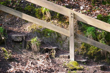 close up of a wooden staircase as a hiking trail through the forest on a mountain