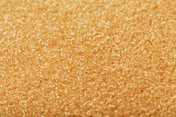 Texture of golden sand on the beach with a solid background in full screen