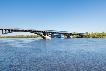 View from the Dnieper River in Kiev to the metro train. Horizon train on the bridge