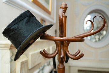 Party Invitation Concept Top Hat and Umbrella on a Coat Stand