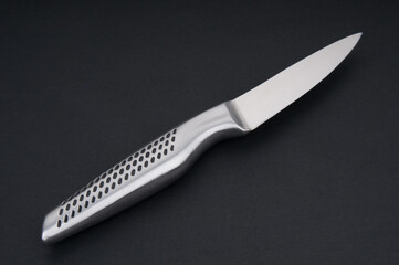 Kitchen knife close up on black background