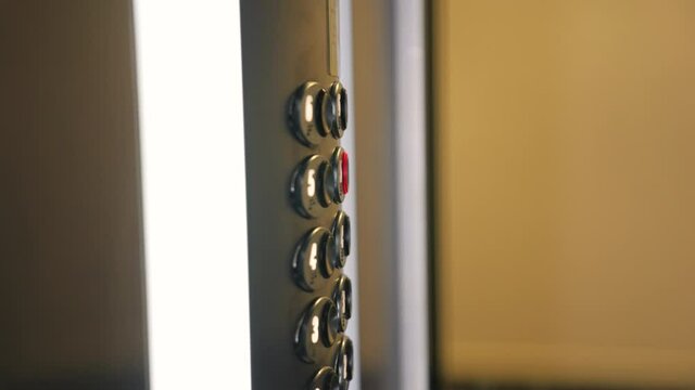 Man's female hand presses elevator button to move up.Movement to success, career. index finger of hand presses elevator button, closing door. concept of success, career growth, upward advancement man.