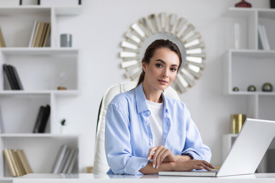 Business Woman Portrait In Blue Shirt At Home Office With Laptop