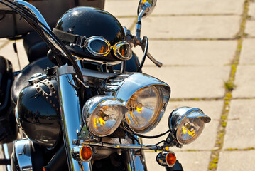 Fototapeta premium Motorcycle steering wheel closeup. Chrome steering wheel elements.