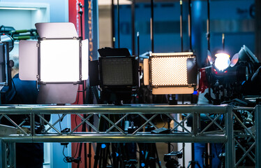 Modern spotlights on metal structure behind stage