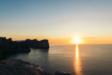 Fototapeta premium sunset in a coast with mountains and cliffs. cap de formentor mallorca