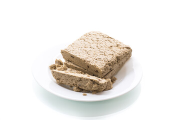 piece of sweet halva on white background