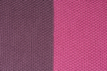 Fototapeta premium Pink and brown knitted fabric pearl woolen background. The structure of the fabric with a natural texture. Fabric background. Knitted woolen background.