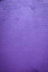 Purple artistic high wall with grainy texture in details