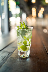Mojito or caipirinha cocktail with lemon and mint, cold refreshing drink or beverage with ice. caipi or Gin tonic
