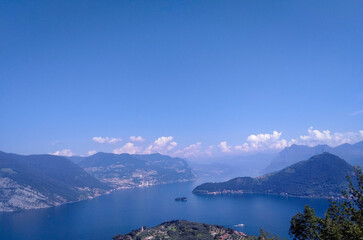 Spectacular view of Lake Lovere, green mountains in the background, in the province of Bergamo, Italy.