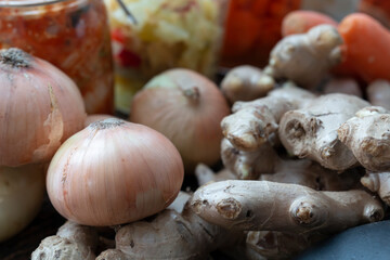 Fresh Garlic, Ginger, Carrot, Onion. Vegetable in bowl for making kimchi. Mixed raw vegetables in traditional bowl used for cooking and making preserved food.