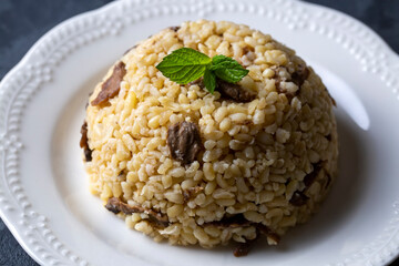 Turkish foods; Bulgur pilaf with mushrooms (Turkish name; mantarli bulgur pilavi)