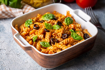 Basil leaves on pasta with arabiata sauce