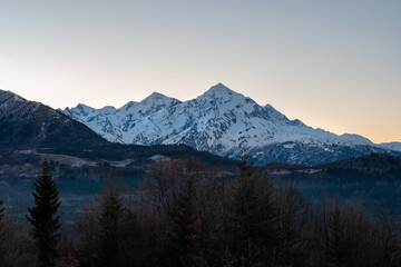 Fototapeta na wymiar Mount Tetnuldi rises above the Great Caucasian Range in the upper Svaneti