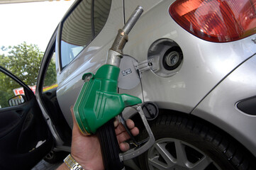 dispenser and tank nozzle when refueling a car