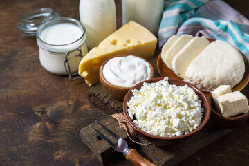 Set of different dairy organic products (milk, sour cream, cottage cheese, yogurt and butter) on a...
