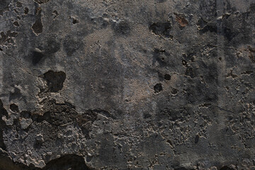 Old rustic grungy aged painted facade of rusty smudged daub. Rough grime edged wall. Wrinkled uneven plastering. Cracked chipped messy falling stucco.Dirty vintage flaking textured layer for 3D design
