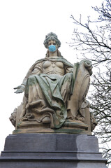 statue with facemask