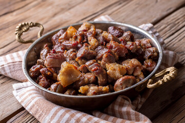 Muslims Traditional Sacrifice holiday food lamb, Turkish roasted meat in copper pot on table top. Turkish Kavurma.