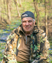 Elderly man on a walk in the woods