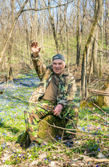 Elderly man on a walk in the woods