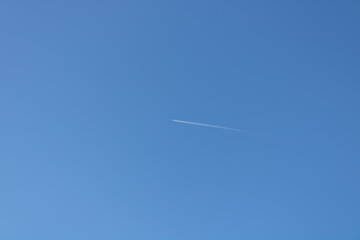 blue spring sky and a small plane