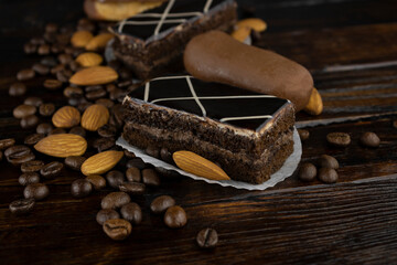 Sponge chocolate cake with a scattering of coffee beans and almonds