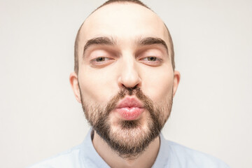 Fototapeta premium In love person sending air kiss, portrait, close up