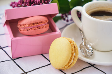 Macaroons on plate on a checkered tablecloth