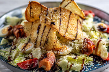 Caesar salad with chicken rolls