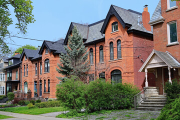 Fototapeta na wymiar Street with large old semi-detatched houses with gables