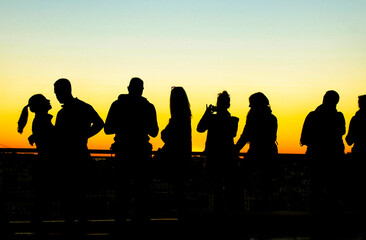 Fototapeta na wymiar People watching the sunset in a viewpoint of Lisbon in Autumn