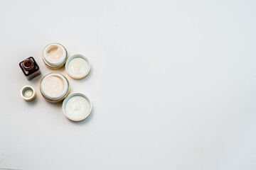 face cream in gold colour on white background