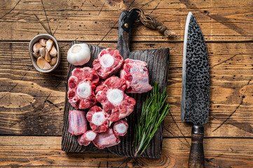 Raw beef Oxtail cut Meat on wooden cutting board with knife. wooden background. Top view - obrazy, fototapety, plakaty