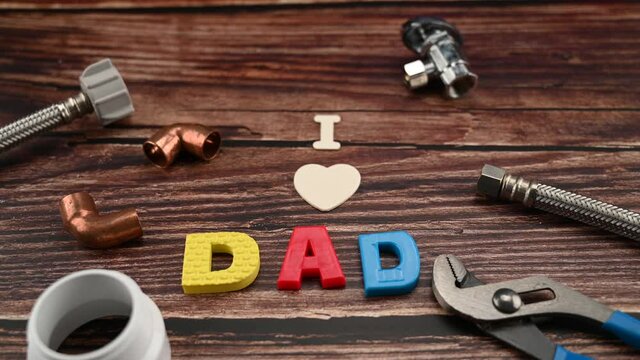 Message I LOVE DAD  with different copper water pipe and fittings plumber tools. for Father's Day or anniversary.
