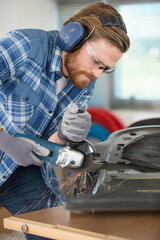 worker beard man with circular saw