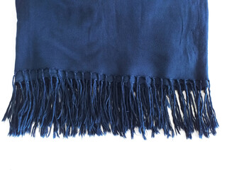 Warm blanket with blue fringes isolated. Close up of fringed cotton fabric. Soft, folded and...