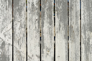 Wood texture creating a nice abstract surface with old white scratched paint.