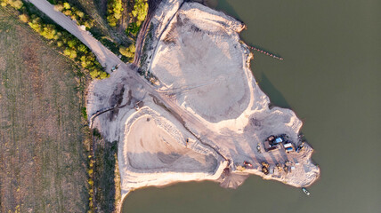 Aerial view of a sand processing plant on the river. Extraction and treatment of all types of...