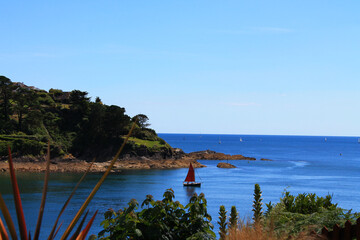 Hiking in Cornwall, sailing boat in the distance