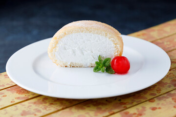 Cream sponge cake with icing and mint