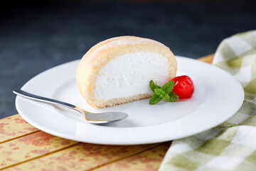 Cream sponge cake with icing and mint