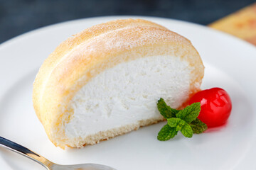 Cream sponge cake with icing and mint