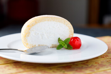 Cream sponge cake with icing and mint