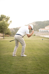 Golf player celebrating victory with his arm