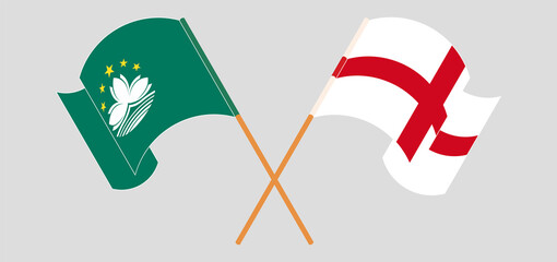 Crossed and waving flags of Macau and England