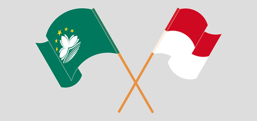 Crossed and waving flags of Macau and Monaco
